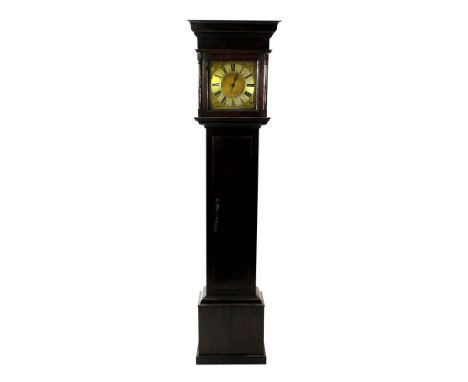 An oak cottage longcase clock 18th century the cushion moulded cornice above a plain frieze and square glazed door flanked by