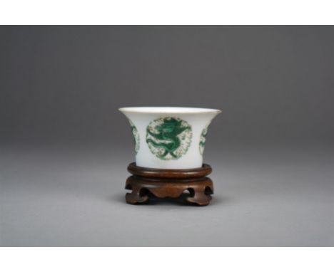 A Chinese green dragon wine cup Probably Daoguang Of inverted bell form, painted in green enamel with four dragons in cloudy 