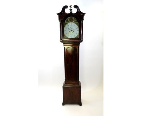 A George III mahogany longcase clock the broken scroll swan neck pediment centred by an eagle and urn finial above and arched