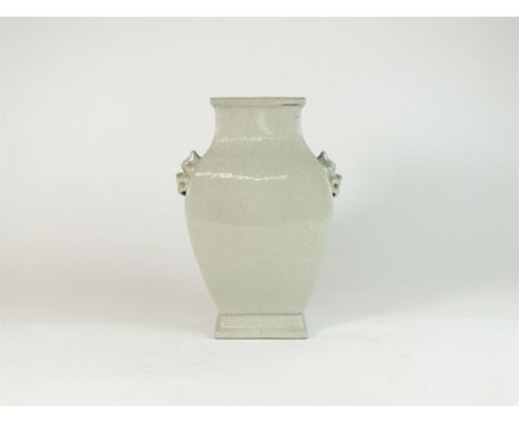 A Chinese archaic style guan vase, 19th/20th century, of square baluster section with moulded lion mask and ring handles, and