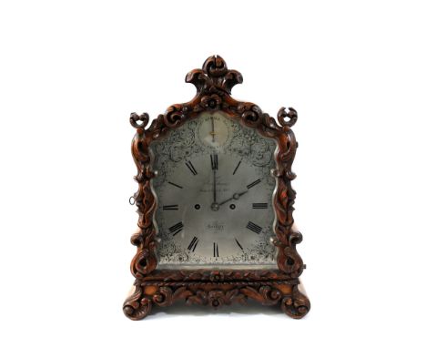 Frodsham; an oak cased bracket clock, second quarter 19 th century, the shaped case with fleur de lys carved finial and folia