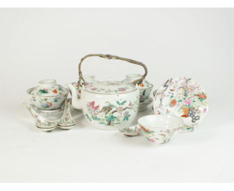 A set of four Chinese famille rose porcelain cups, covers and stands, Guangxu (1875-1908) each of reeded form and decorated w