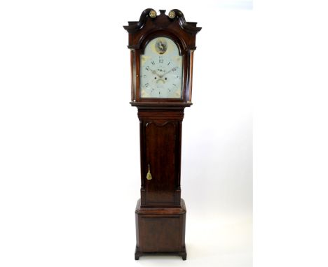 A George III oak and mahogany cross banded longcase clock the broken scroll swan neck pediment with gilt brass stamped basket