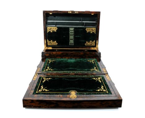 A Victorian gothic coromandel and gilt metal mounted writing box, the domed cover applied with gothic strap work and monogram