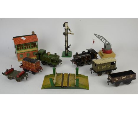 Hornby L.N.E.R 0-4-0 clockwork tank engine, another in L. M. S livery, together with various carriages, rolling stock and acc