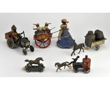 Five American tinplate models, 20th Century, to comprise a nanny wheeling two boys in a pram, a Louis Mary Co. clown in car, 