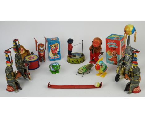 TIN TOYS. A Yanoman Acrobat Monkey (missing key). A Clockwork Musical Monkey with Clashing Cymbals, a drumming monkey. A Shac
