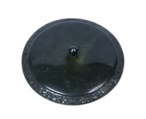 Mughal jade lid India, 18th Century carved to the border with a scrolling foliate pattern, with a raised finial to the middle