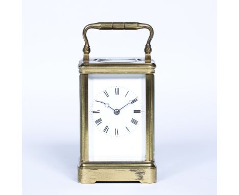 Brass cased carriage clock  with loop handle and Roman numerals, with key, 7cm wide x 7cm deep x 12cm high