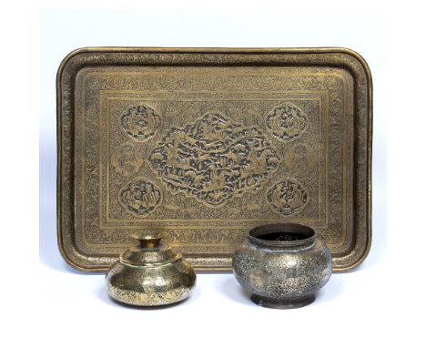 Collection of Qajar metalware Iran, 19th Century comprising of a rectangular brass tray (Qalanzabi) engraved with a central m