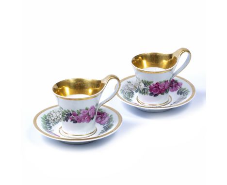 Pair of KPM Berlin cabinet cups and saucers circa 1820, in the Biedermeier taste, finely painted bands of pink and white flow