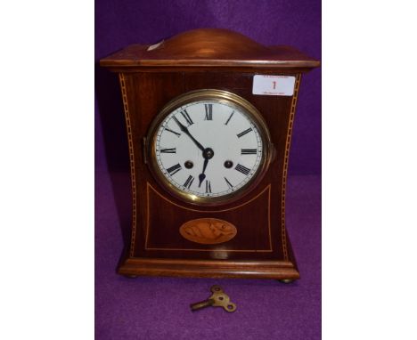 An Edwardian inlaid mahogany mantel clock having enamel dial with roman numerals and standard striking movement 'Teautonia cl