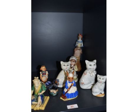 A selection of ceramic figures and studies including Chinese mudman Royal Doulton Mrs Bunnykins and Hummel