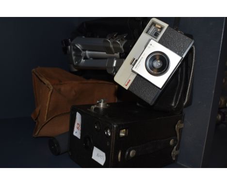 A vintage box camera, a Kodak instamatic 25 and a Velbon tripod.