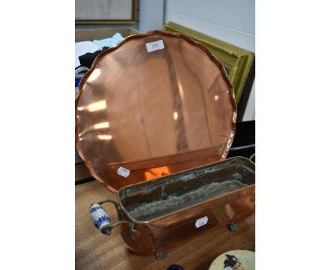 A scalloped edged serving tray in copper and similar copper and ceramic handle fish steamer