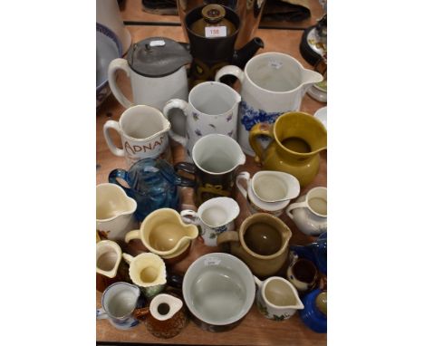 A selection of water and similar ceramic jugs including Denby coffee pot