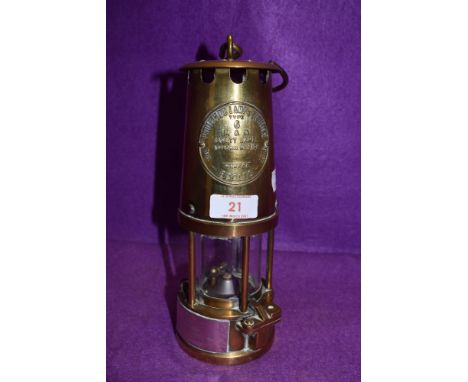 A brass presentation miners lamp by protector lamp and lighting No. 6 Eccles