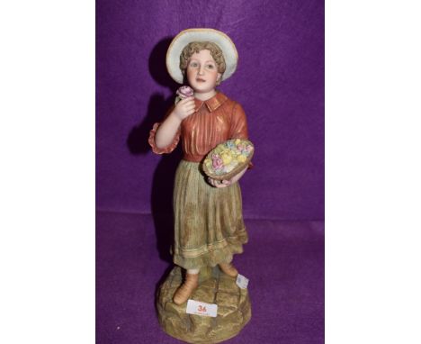 A figure of a flower seller in a bisque glaze signed W Drake 1397 R&amp;L
AGE RELATED WEAR TO BASE OTHERWISE GOOD
