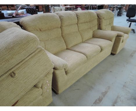 A modern G plan three piece suite in straw colour design, with storage stool and pouffe