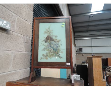 An early 20th Century mahogany framed painted glass firescreen
