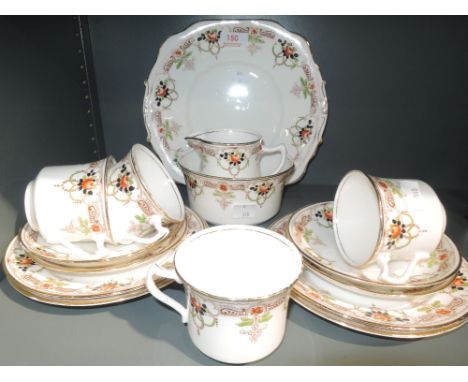 A vintage hand decorated part tea service