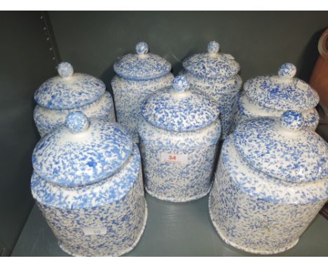 A selection of vintage ceramic kitchen jars by Arthur Wood in the Saxony design