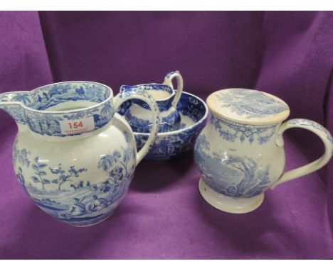 A selection of vintage blue and white ware ceramic jugs including early Spode and Wedgwood