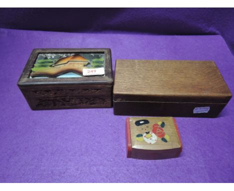 Three wooden jewellery boxes and a ceramic box of various forms