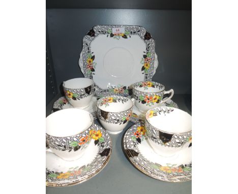 A vintage part tea service with hand decorated design work