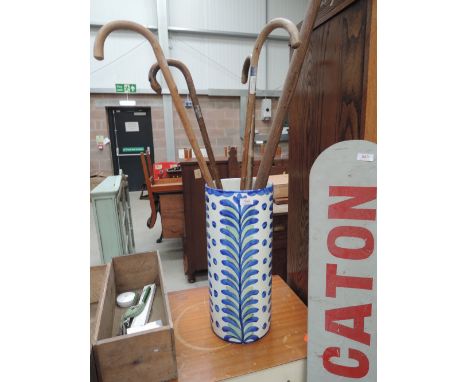 A continental ceramic stick stand and contents