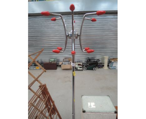 An atomic style coat and stick stand