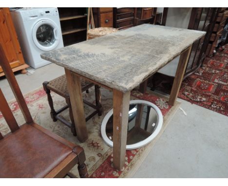 A golden oak frame side table with worked stone top, fossil fern decoration