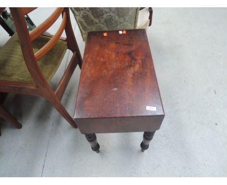 A Victorian mahogany box commode on turned legs , no interior
