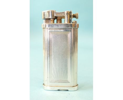 An Alfred Dunhill silver-cased 'Unique' lighter with engine-turned engraving, hallmarked for London 1995, 66mm tall, in case 