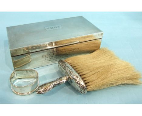 An engine-turned silver cigarette box, with initials and inscription, 18 x 9 x 5cm, Birmingham 1938, a silver-handled crumb b