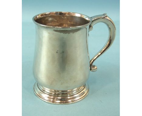 A George II small baluster tankard with lapette-capped handle, 10cm high, maker EV, London 1734, ___9oz.