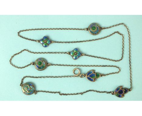 An Art Nouveau silver chain interspersed with seven various blue and green enamel plaques, each composed of two identical pan