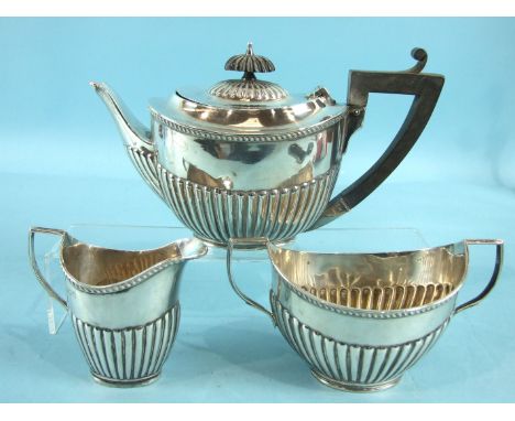 A bachelor's three-piece tea service of half-gadrooned form, London 1911, total weight ___13½oz.