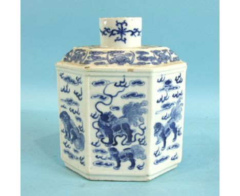 A 19th century Chinese six-sided caddy with panels decorated with Buddhist lions in clouds, 17.5cm high.