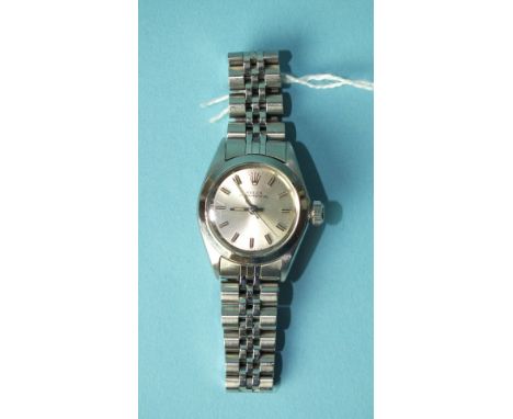 Rolex, a lady's Rolex Oyster Perpetual wrist watch with silvered dial, baton numerals and centre sweep seconds, steel case an