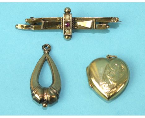 A small 15ct gold brooch set ruby and two pearls, (a/f), 2.8g, a heart-shaped locket and a pendant, (3).