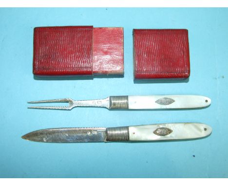 An early-19th century travelling set of mother-of-pearl-handled folding silver knife and fork, 34mm (open), in red Morocco ca