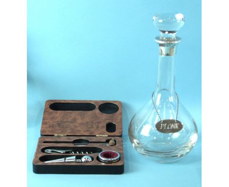 Asprey, a modern decanter of plain form with silver collar and silver label, "PLONK", and a cased wine set of corkscrew, ther