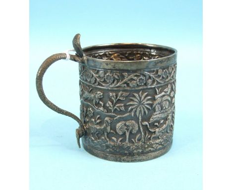 A Burmese silver tankard typically-decorated with wild animals, foliage and serpent-form handle, 9cm high.