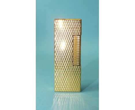 A Dunhill gold plated rollagas lighter.
