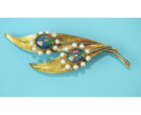 An 18ct yellow and white gold leaf brooch set two pearl and synthetic black opal clusters, 85mm long, 17.9g.