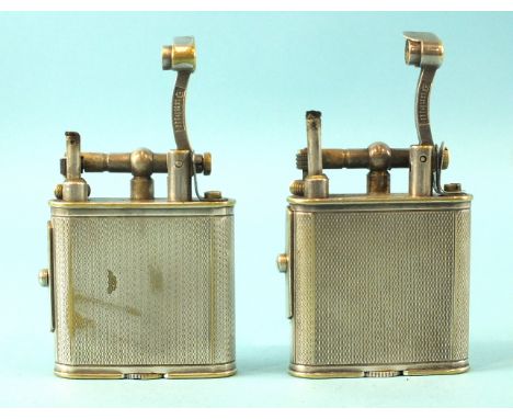 A Dunhill silver-plated pipe lighter, patent no. 390107, 52mm, in leather pouch and another, (no pouch), (2).