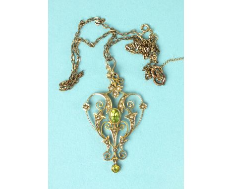 An Edwardian peridot and seed pearl pendant of scrolling form, on plated chain.
