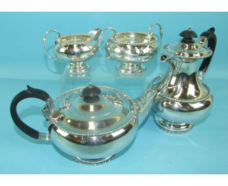 A four-piece Walker &amp; Hall silver tea service with beaded rim decoration, comprising a teapot of compressed form, a hot w