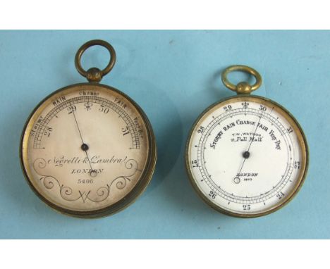 A pocket barometer, the silvered dial signed 'Negretti and Zambra, London', no.5406, 5cm diameter and another, the white enam